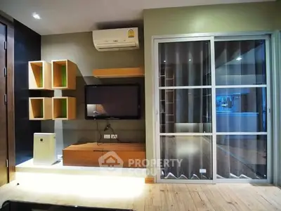 Modern living room with stylish shelving and air conditioning