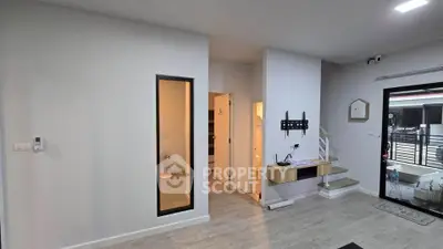 Modern interior with staircase and wall-mounted TV bracket in a cozy living space.