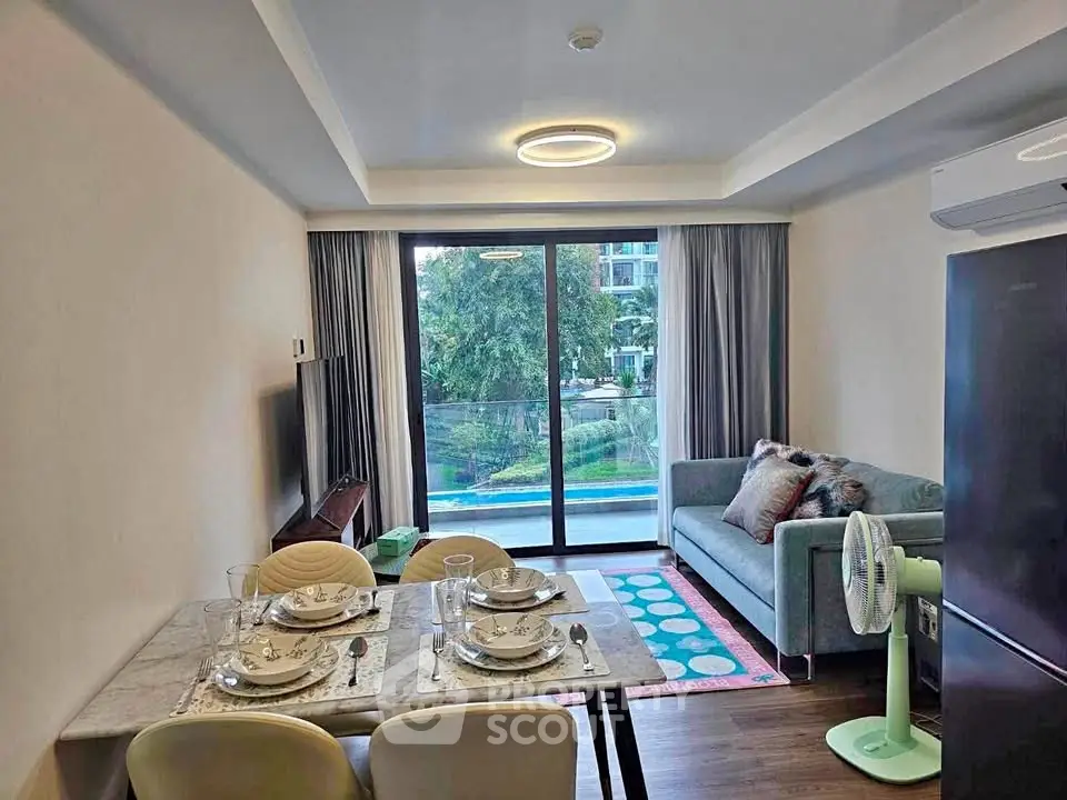 Modern living room with dining area and balcony view in a stylish apartment.