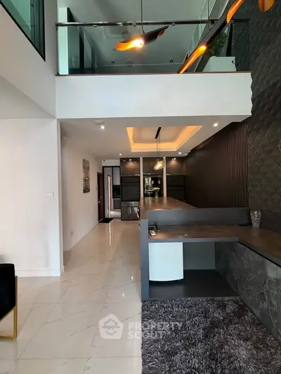 Modern interior with mezzanine, sleek design, and elegant lighting in a stylish living space.