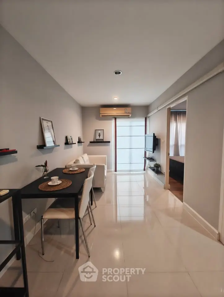 Modern living room with sleek design, open layout, and stylish furniture in a contemporary apartment.
