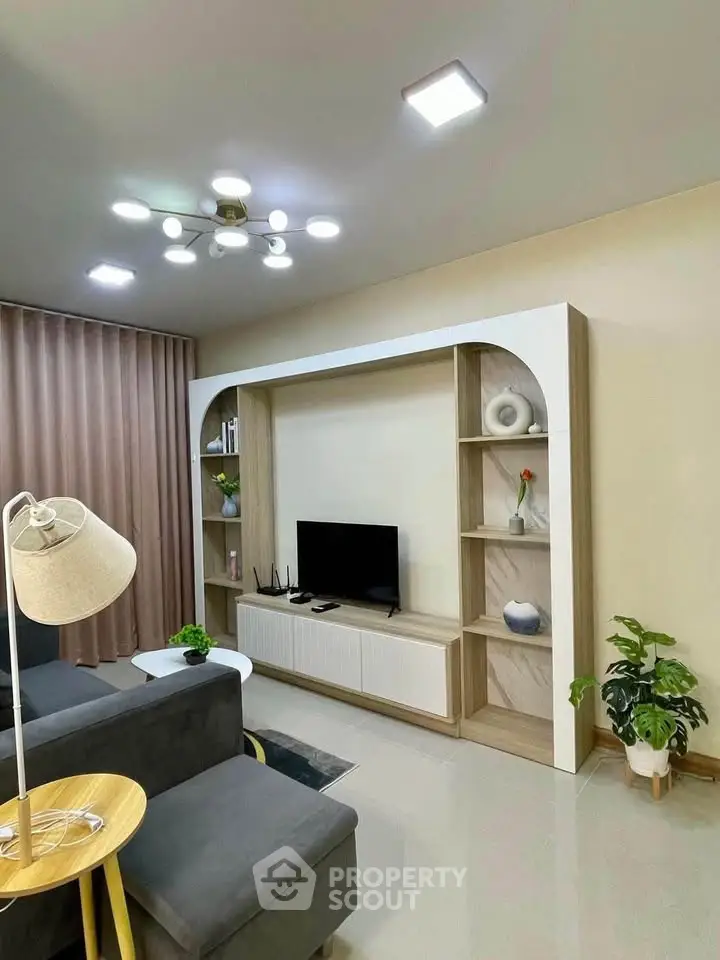 Modern living room with stylish TV unit and elegant decor