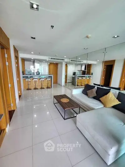 Spacious modern living room with open kitchen and sleek design