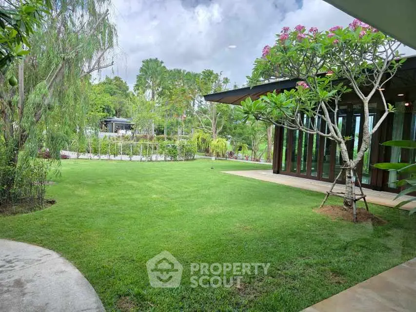 Luxurious garden view with modern architecture and lush greenery