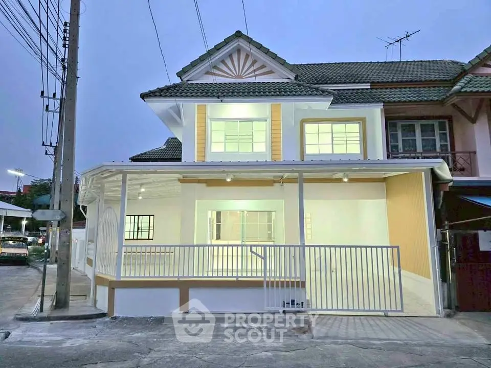Charming two-story house with modern facade and spacious balcony in a serene neighborhood.