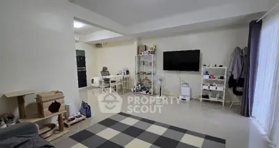 Spacious living room with modern decor and entertainment setup