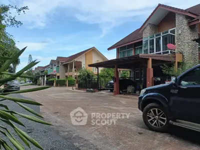 Charming suburban street with modern houses and lush greenery, perfect for family living.