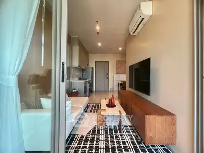 Modern living room with stylish decor and air conditioning in a cozy apartment.