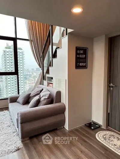Modern living room with loft-style design and city view
