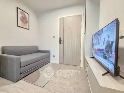 Cozy living room with modern decor and flat-screen TV