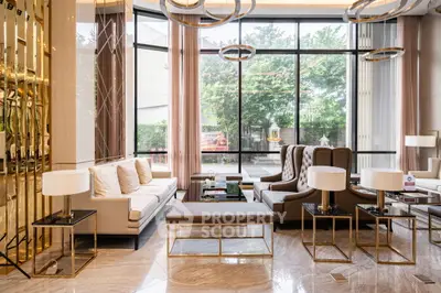 Luxurious modern living room with elegant furniture and floor-to-ceiling windows.