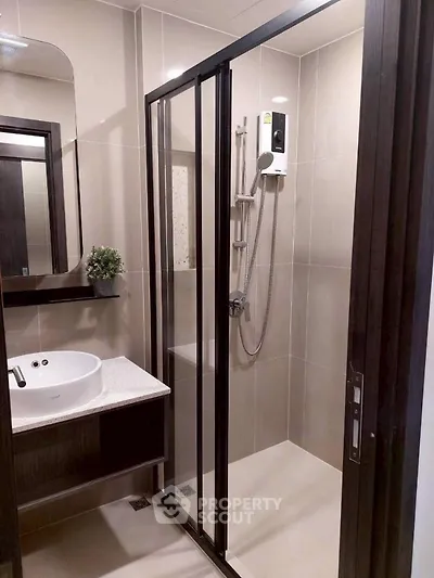 Modern bathroom with sleek shower enclosure and stylish vanity