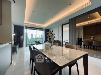 Luxurious open-plan living and dining area with city view and modern decor.