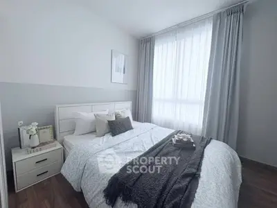 Cozy bedroom with elegant decor and natural light, featuring a comfortable bed and stylish furnishings.
