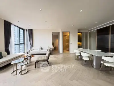 Luxurious modern living room with elegant dining area and large windows offering city views.