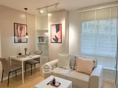 Modern living room with cozy sofa, dining area, and stylish decor in a bright apartment.