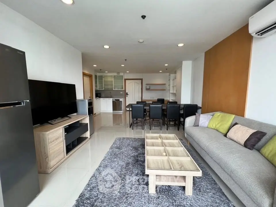 Spacious modern living room with open kitchen and stylish decor