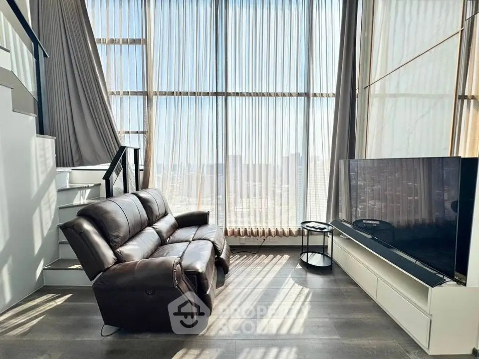 Luxurious modern living room with high ceilings and large windows offering stunning city views.
