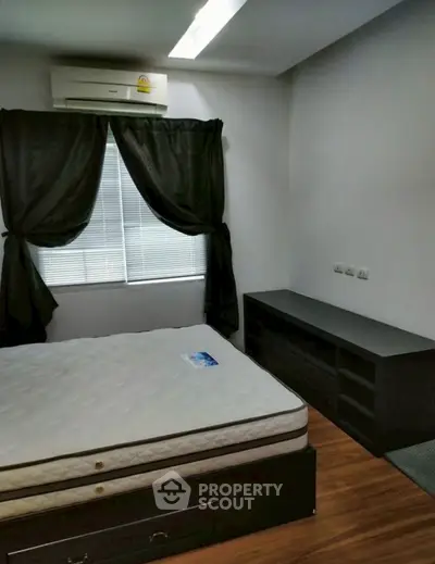 Cozy bedroom with modern furnishings and natural light