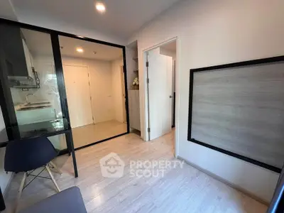 Modern apartment interior with sleek kitchen and cozy seating area