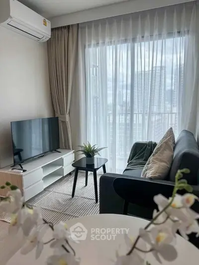 Modern living room with large window and stylish decor