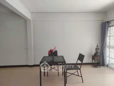 Minimalist interior with simple dining setup and natural light