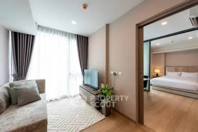 Modern apartment interior with cozy living room and elegant bedroom