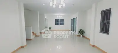 Spacious modern living room with bright lighting and minimalist decor