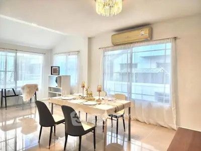 Elegant dining area with natural light and modern decor