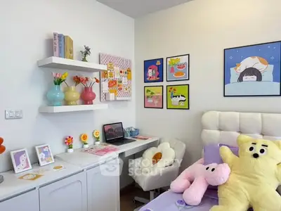 Charming bedroom with cozy decor and vibrant wall art, perfect for a playful and inviting atmosphere.