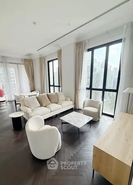 Luxurious living room with modern furniture and stunning city view through large windows.