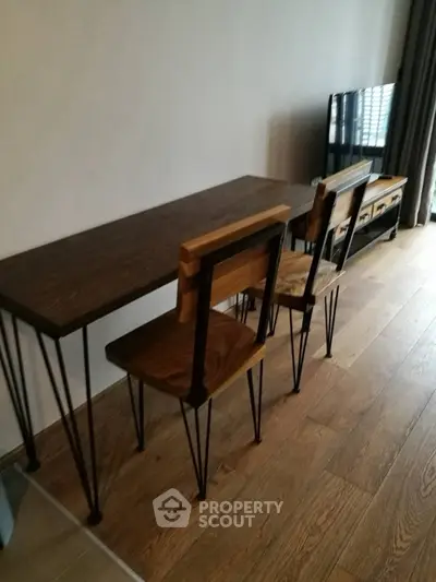 Stylish modern living room with wooden furniture and sleek flooring.