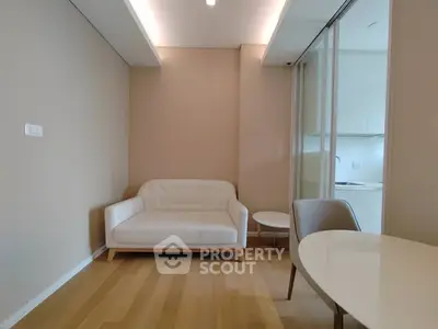 Modern minimalist living room with white sofa and sleek wooden flooring