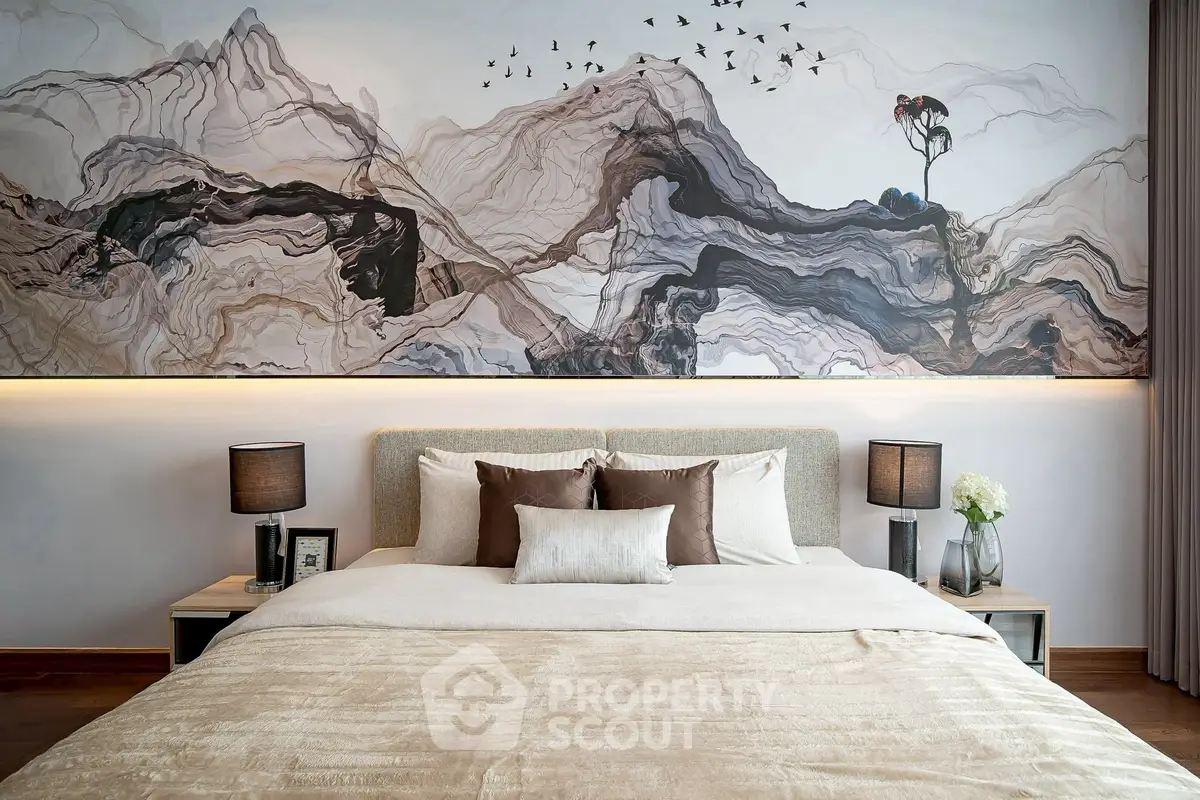 Luxurious bedroom with elegant decor and artistic wall mural, featuring a plush bed and stylish lighting.