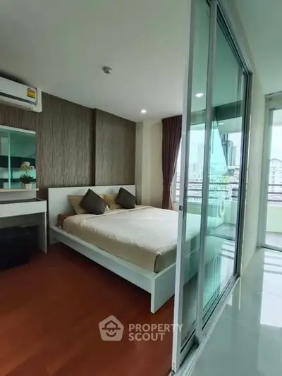 Modern bedroom with balcony view in urban apartment