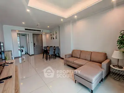 Spacious modern living room with elegant decor and ample natural light