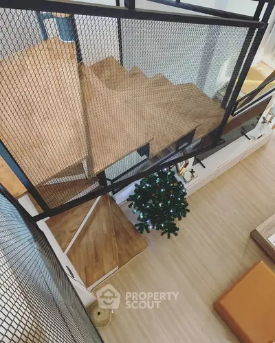 Modern duplex interior with stylish staircase and festive decor