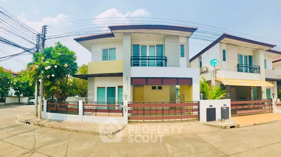 Charming two-story house with modern design and spacious balcony in a serene neighborhood.