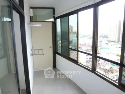 Spacious balcony with city view in modern apartment