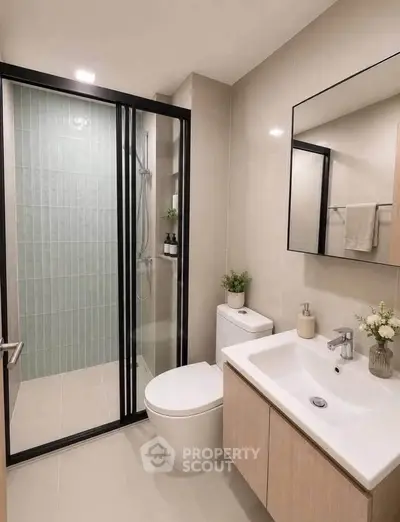Modern bathroom with sleek shower and elegant fixtures