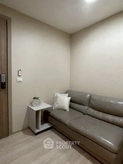 Cozy living room with modern leather sofa and minimalist decor