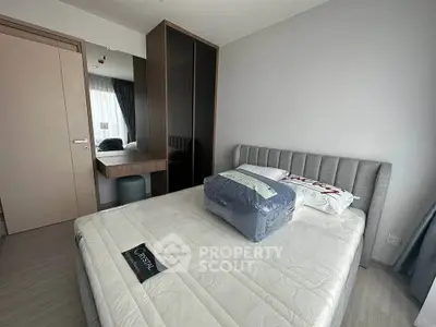 Modern bedroom with stylish furniture and ample natural light