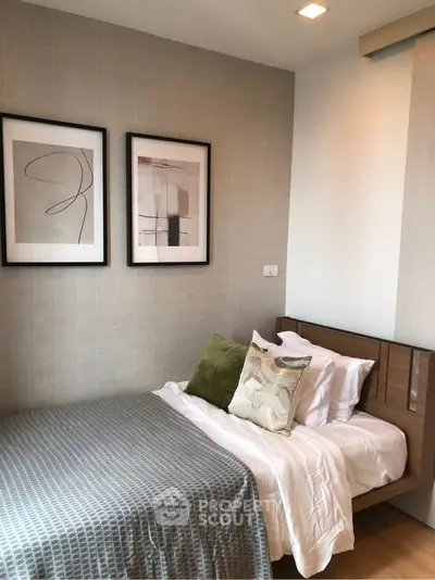 Cozy modern bedroom with stylish decor and framed artwork