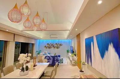 Luxurious modern living room with elegant lighting and stylish decor, perfect for entertaining guests.
