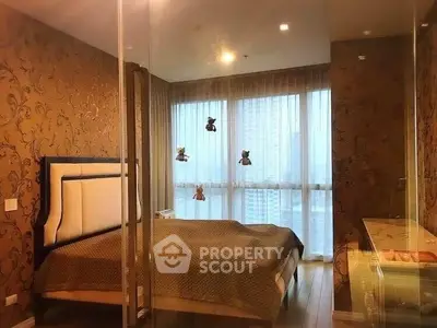 Luxurious bedroom with elegant decor and large windows offering city views.