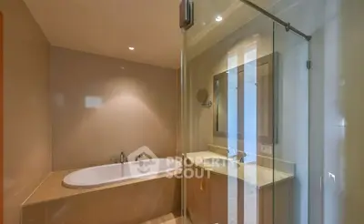 Modern bathroom with glass shower and built-in bathtub