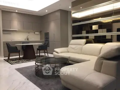 Luxurious modern living room with sleek kitchen and elegant furniture