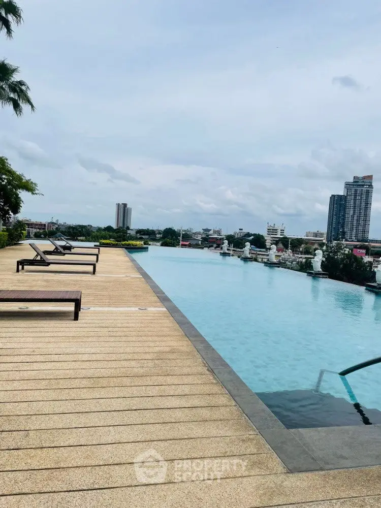 Luxurious rooftop infinity pool with stunning cityscape views and relaxing lounge chairs.