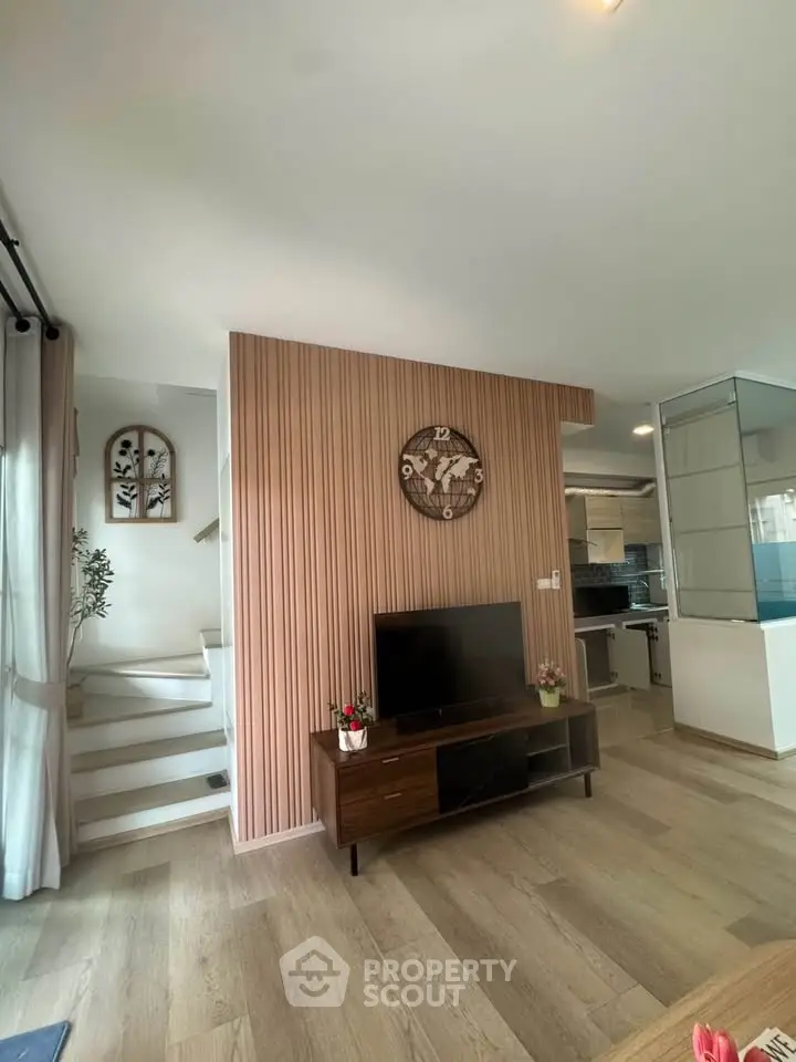 Modern living room with stylish decor and open kitchen layout