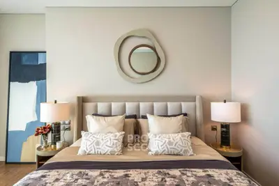 Luxurious bedroom with modern decor and stylish lighting, perfect for relaxation and comfort.